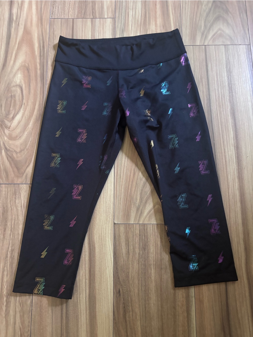 Zumba Fitness Black Capri Leggings with Iridescent Lightning & 'Z' Logos